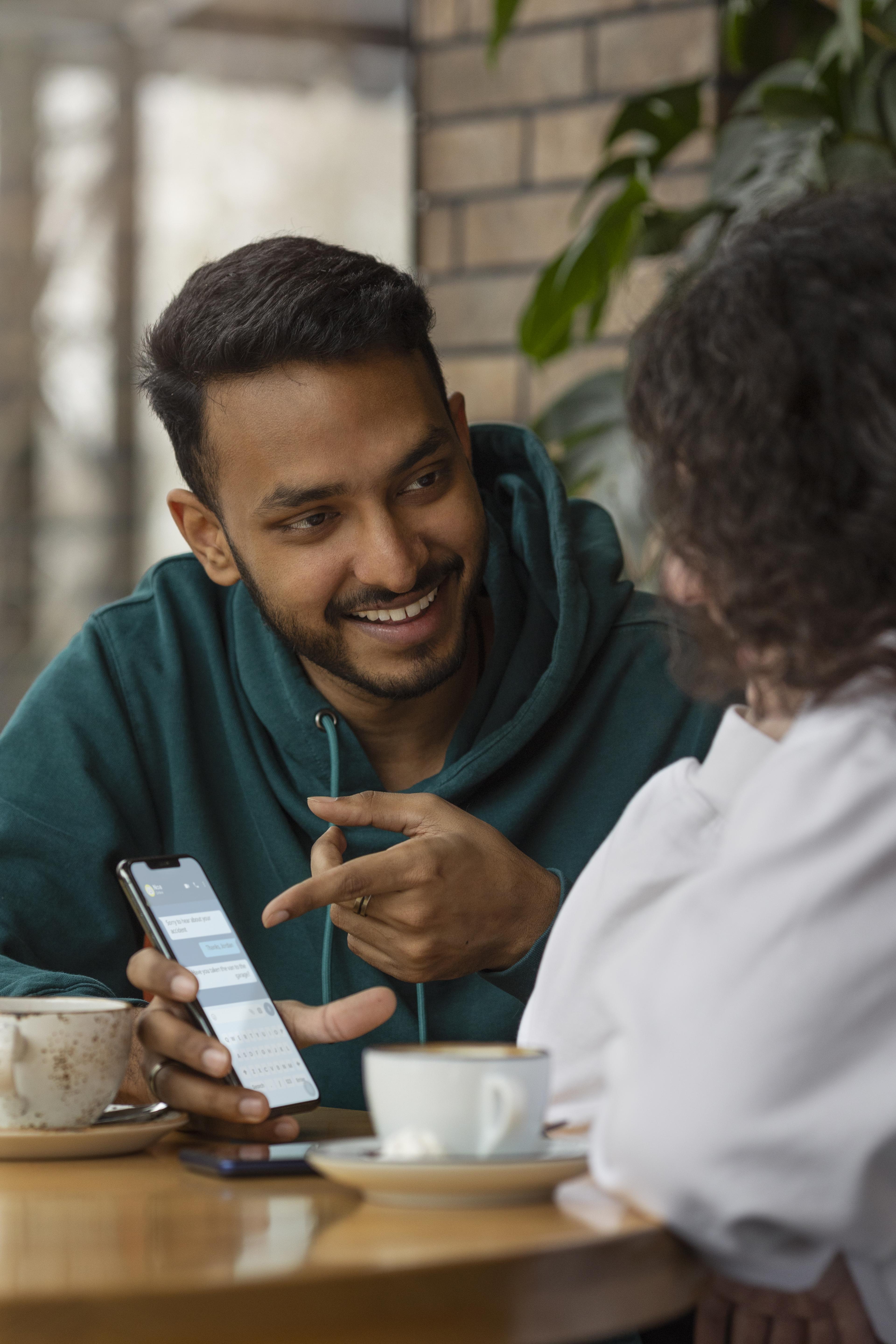 Friends using smartphone for modern communication